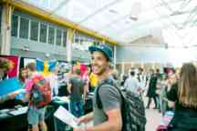 A male student attends the Study Abroad expo