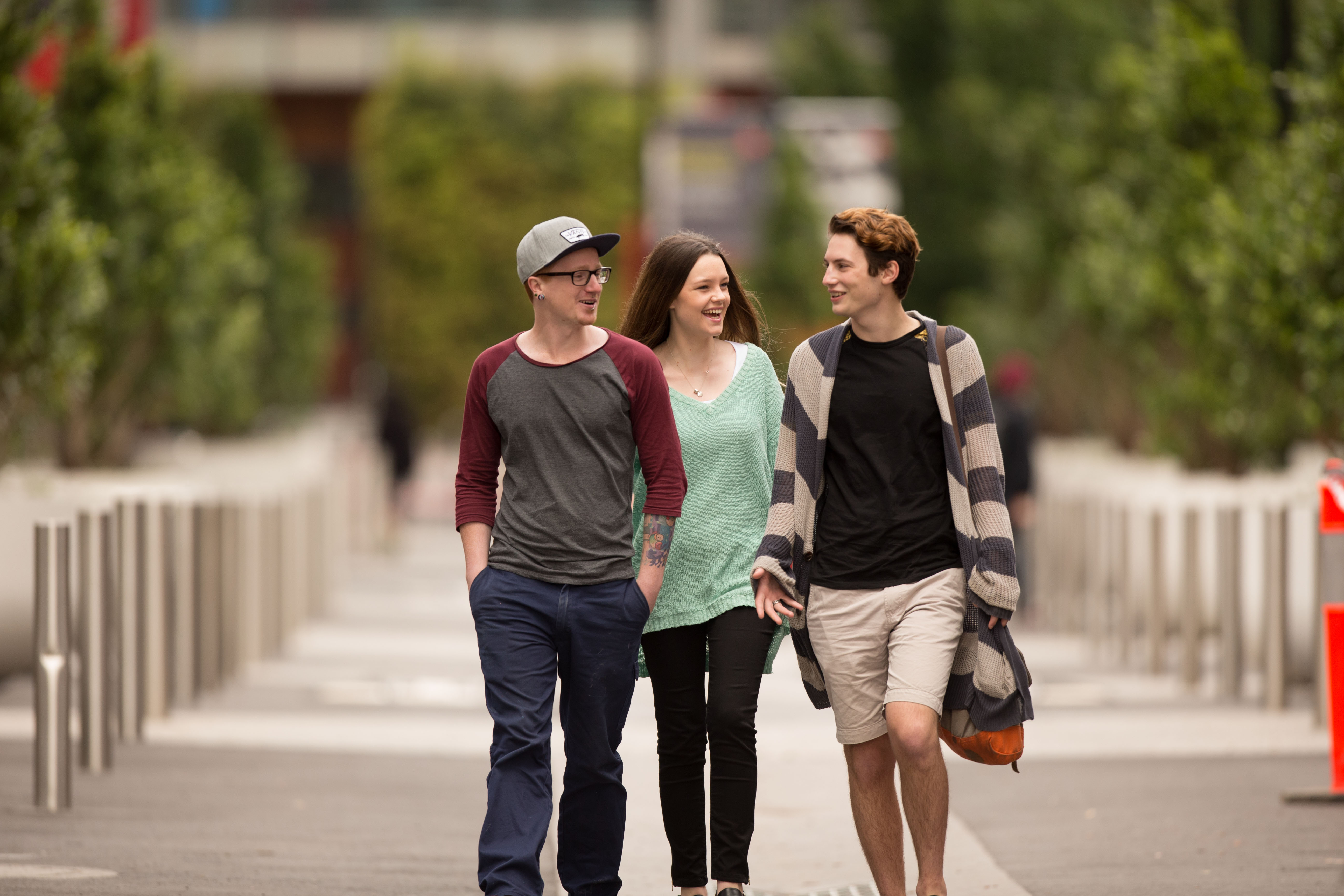 Three undergraduate students walking to class at Hawthorn campus