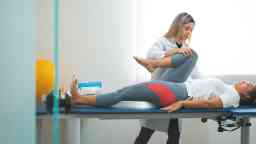 GPR - Global Postural Re-education, doctor doing stretching on her patient's legs