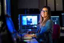 Media student working in the studio editing a video