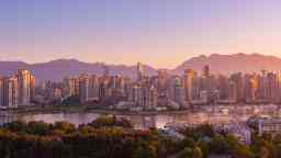 Early morning landscape of Vancouver skyline with mountains in the distance 