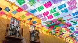 Colorful paper flags over street in San Miguel de Allende Mexico