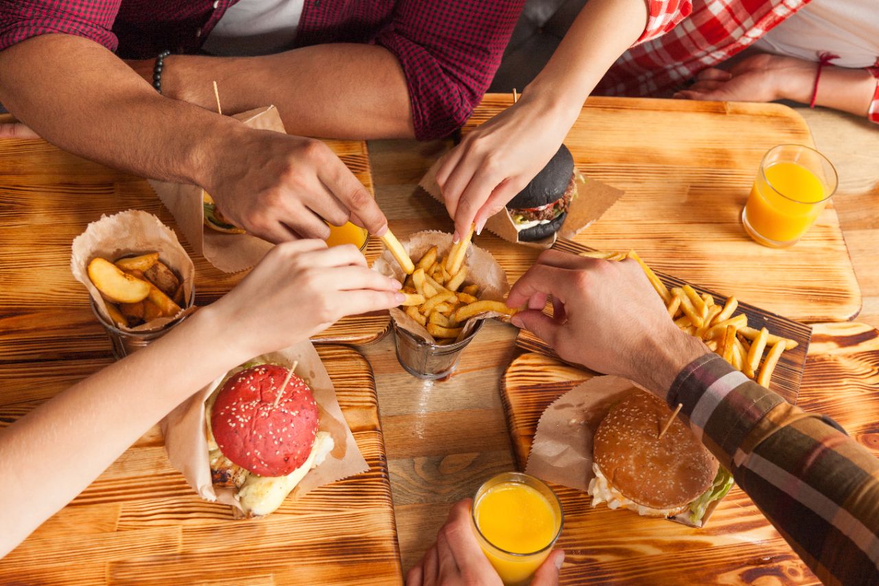 People Group Friends Hands Eating Fast Food Burgers Potato Drinking