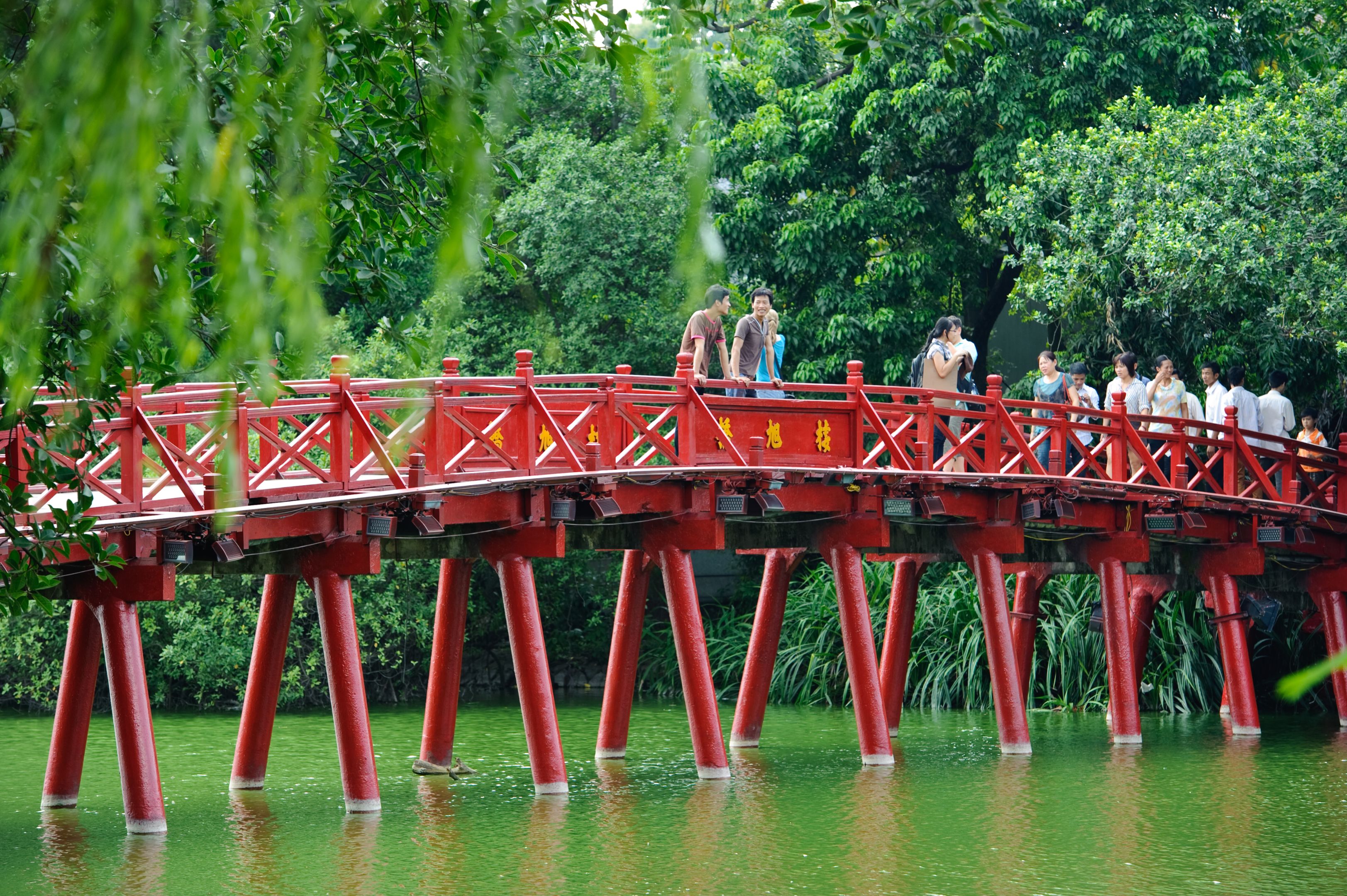 Hanoi red bridge. The wooden red painted bridge over the Hoan Kiem Lake connects the shore and the Jade Island on which Ngoc Son Temple stands