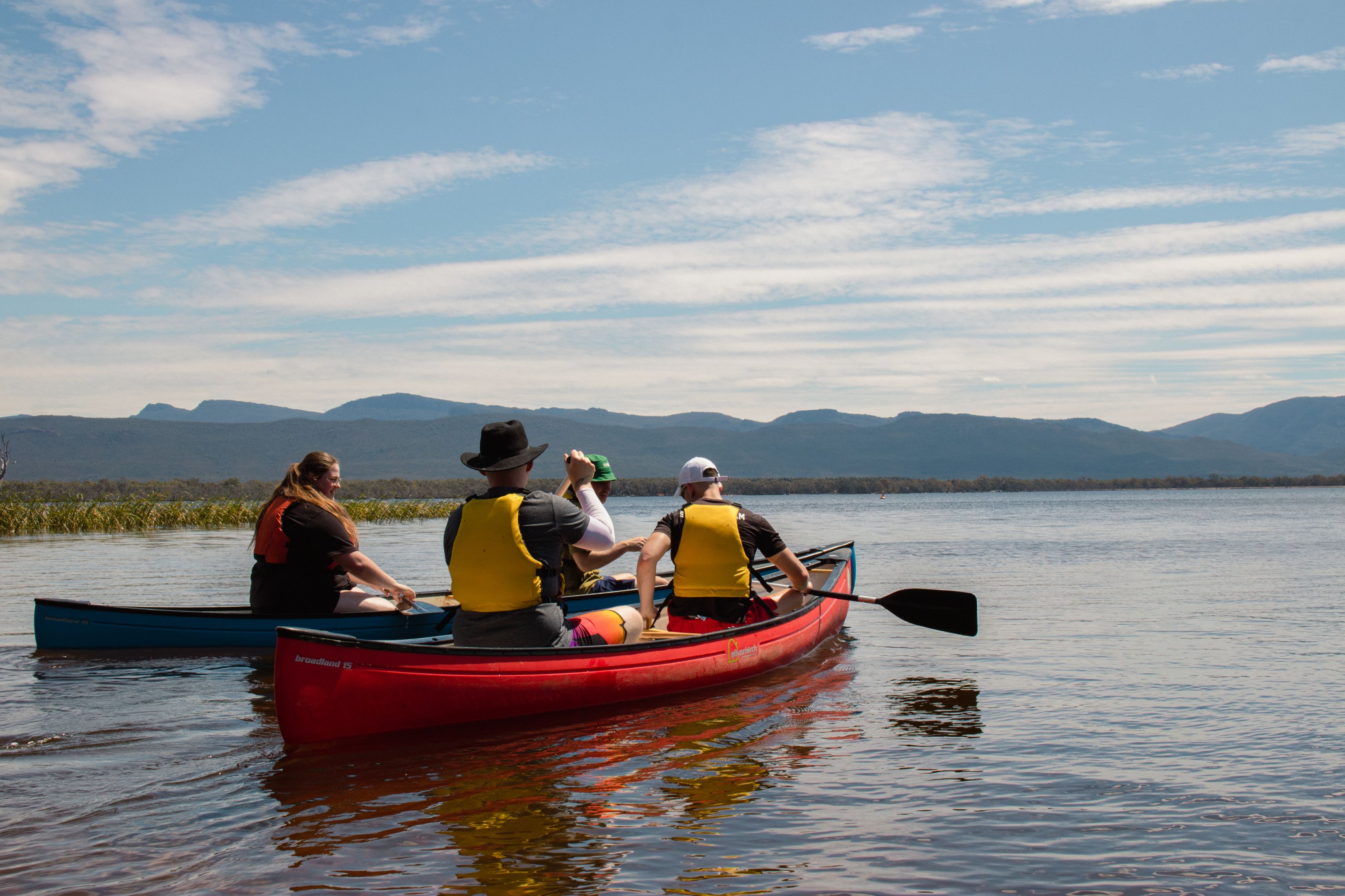 Participants of the MTC On-Country Development Program canoeing on a lake.