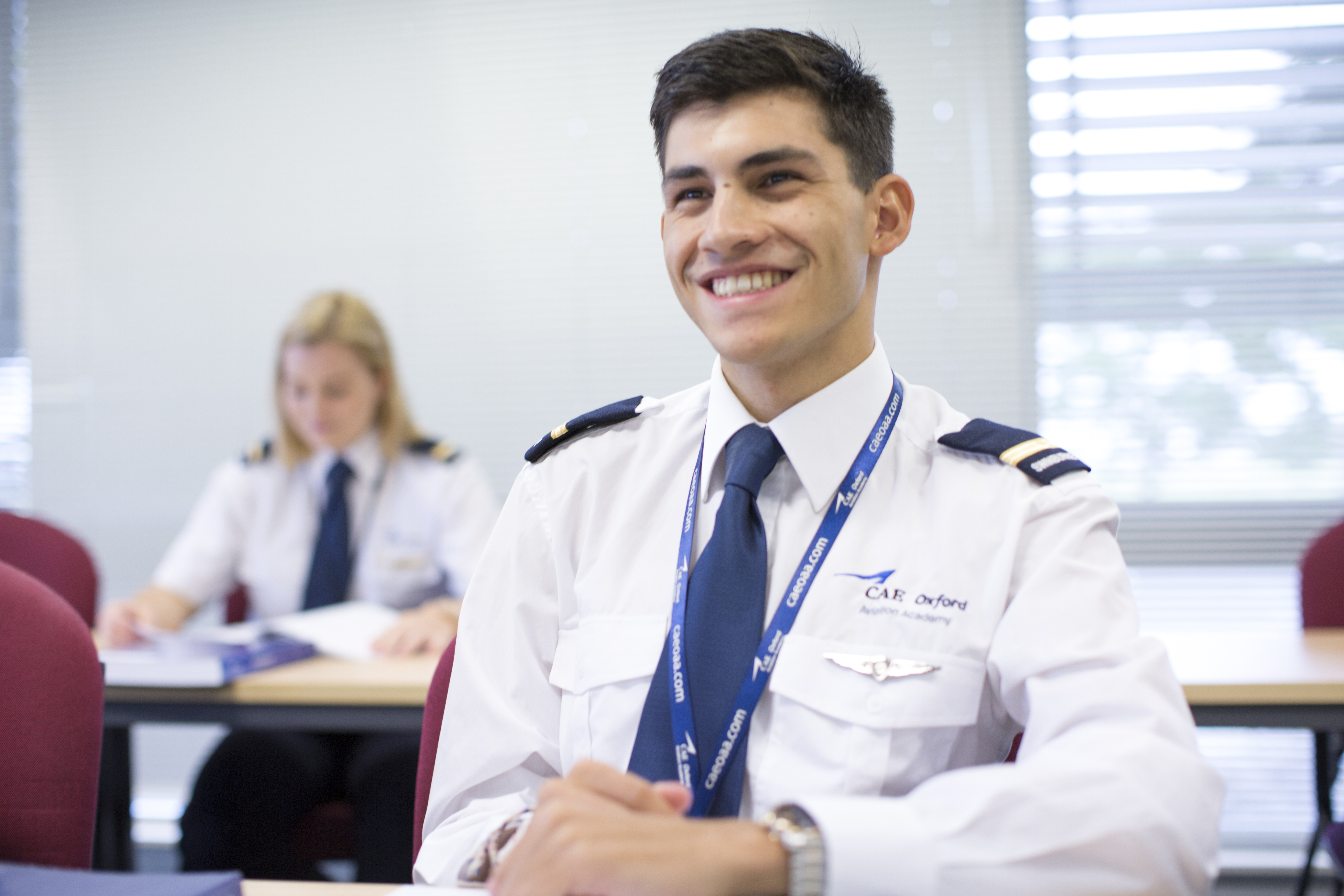 A Swinburne aviation student sitting in a classroom.